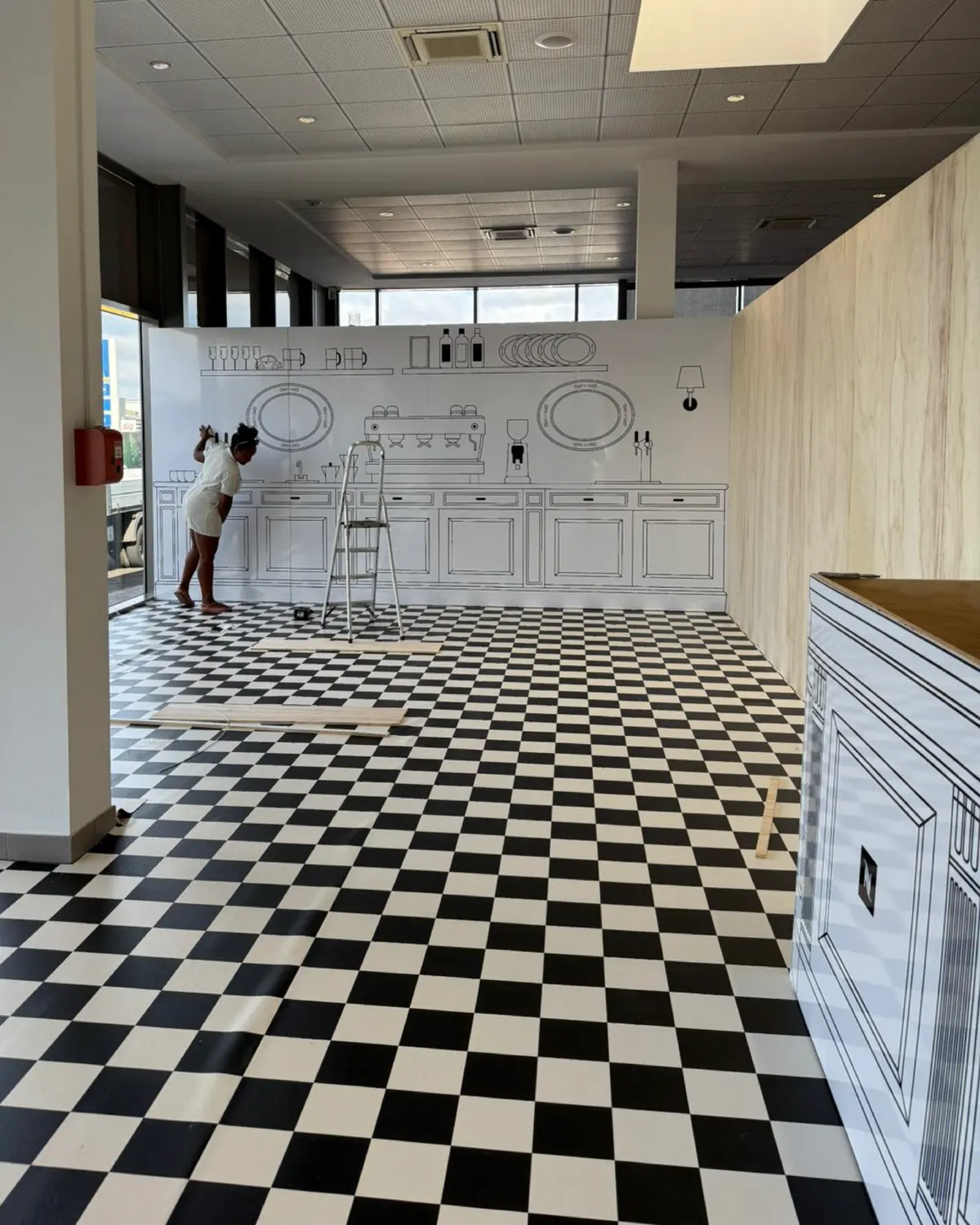 Pose de l'habillage illustré du pop-up dans la concession